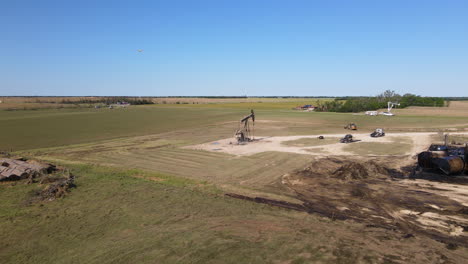 aerial view collapsed well on a field, spilled oil on ground, tornado aftermath