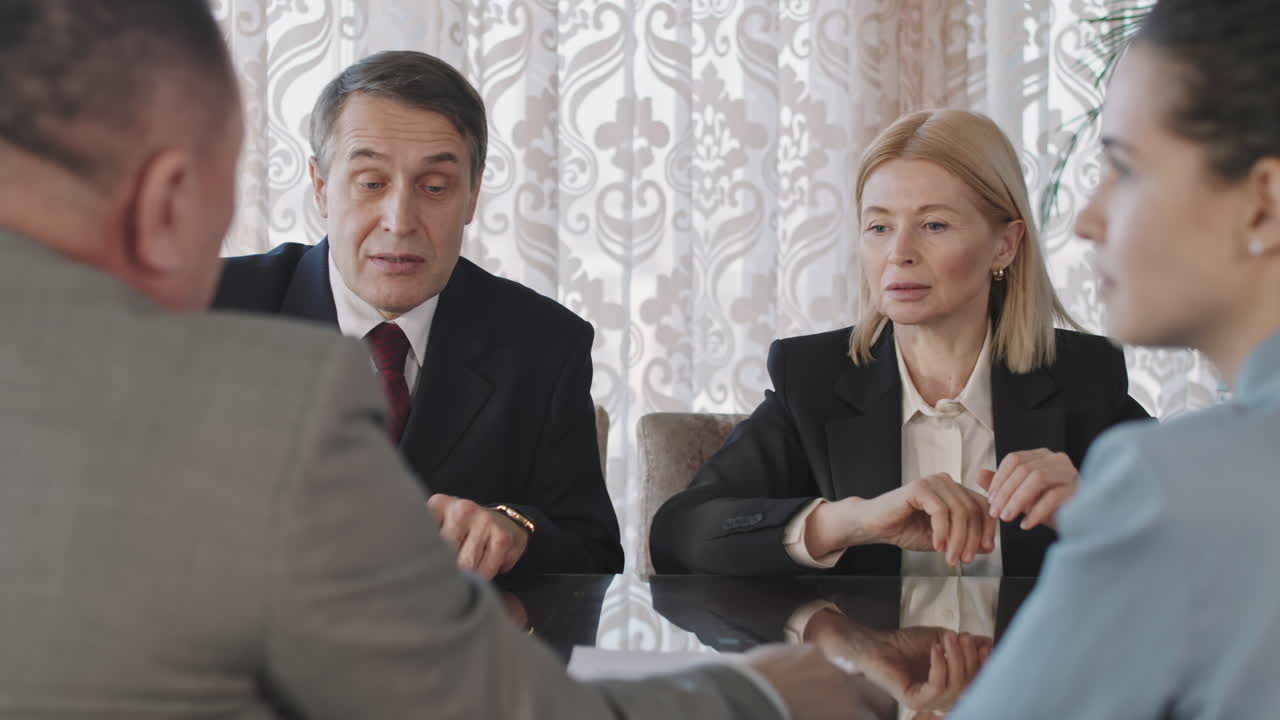 Business Partners Negotiating And Signing Contract