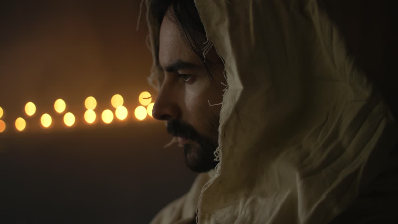 Closeup of the face of Jesus Christ in ambient light for Christianity stock footage