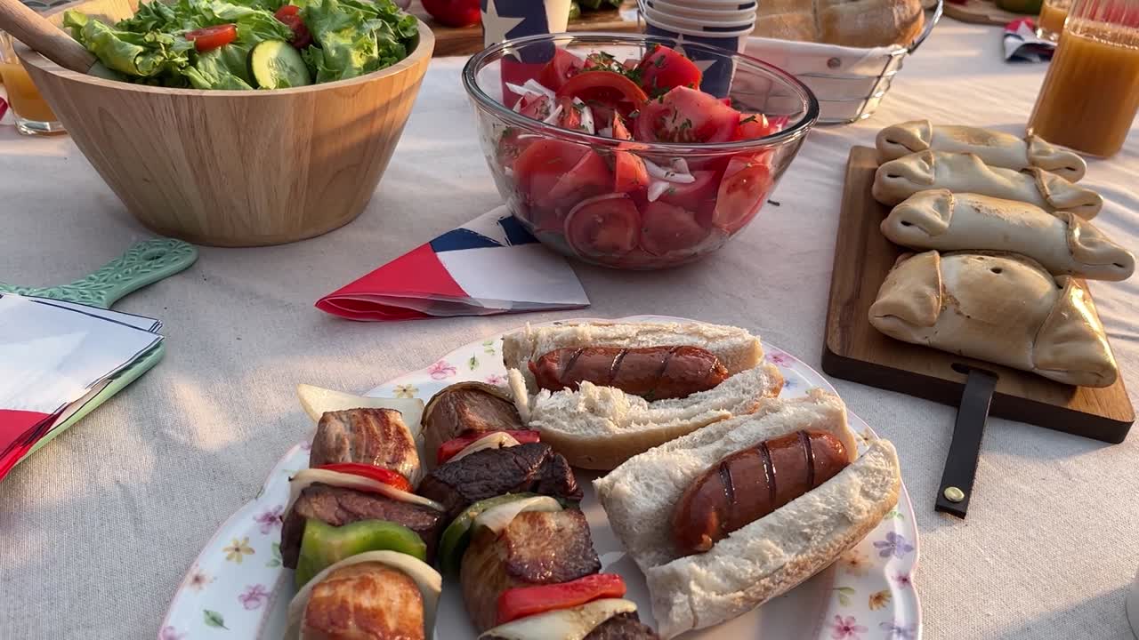 Fiestas Patrias chile grill parrilla meat chorizo table empanadas pebre