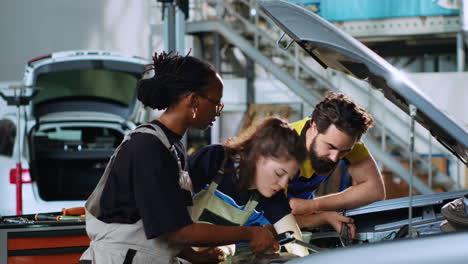 Team-of-engineers-fixing-car