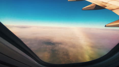 flying over built up brisbane. as clouds pass by. a view from airplane window