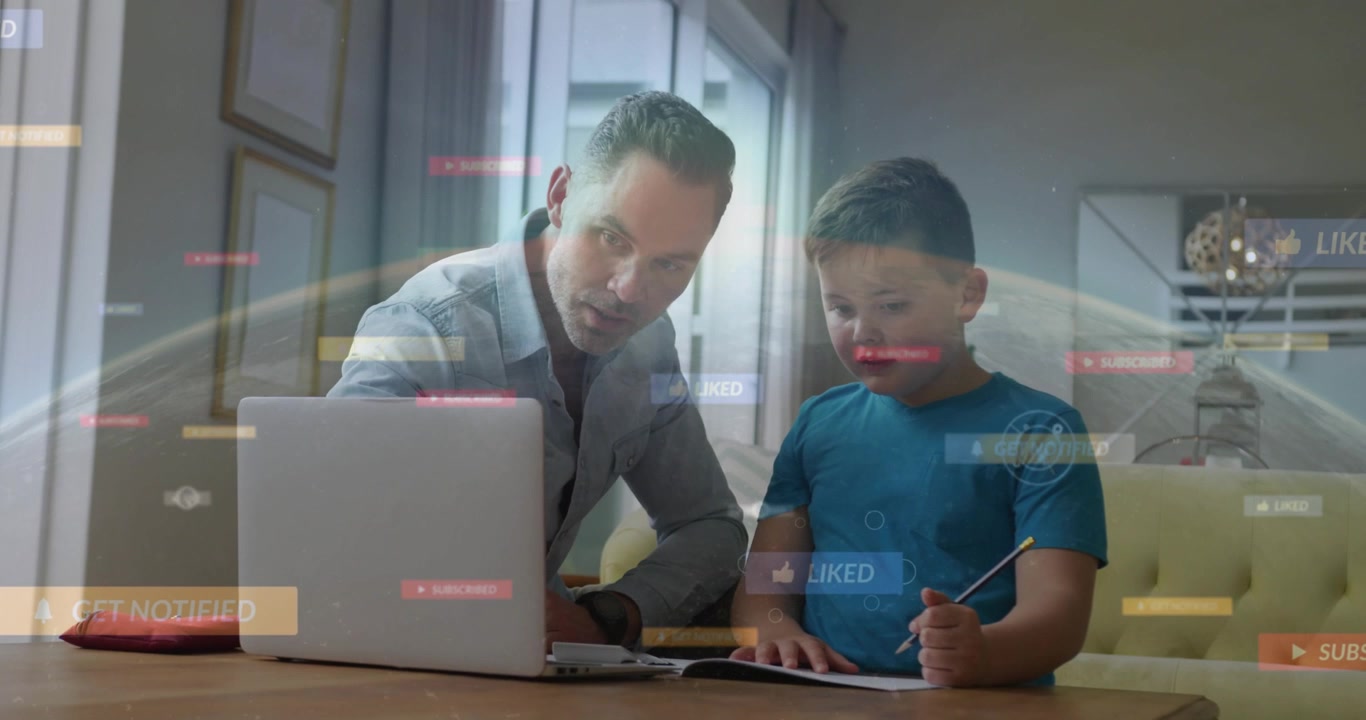 Dad guiding son at wood table, notifications popping over laptop as boy pressing keys for learning