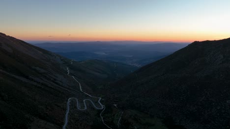 Snaking-road-along-remote-mountain-pass-in-Serra-da-Estrela