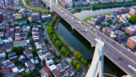 aerial view of city with bridge and river