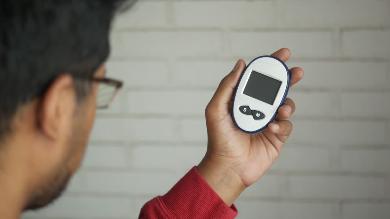 Person Checking Blood Glucose Level