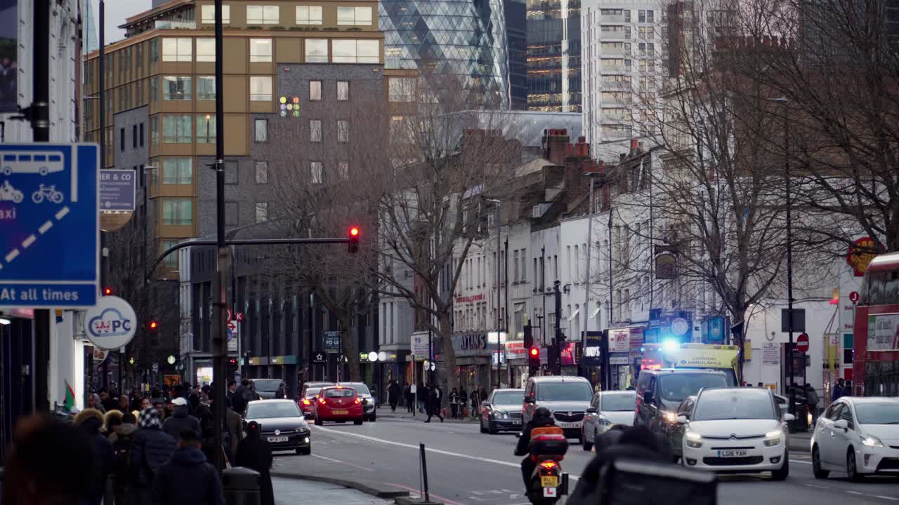 Busy Street in East London, Gherkin in the Background