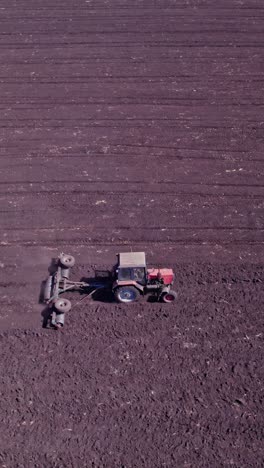tractor preparing soil for planting new crop next season
