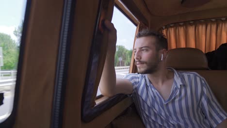 young man listening to music with airpods.