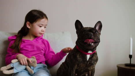 girl playing with dog