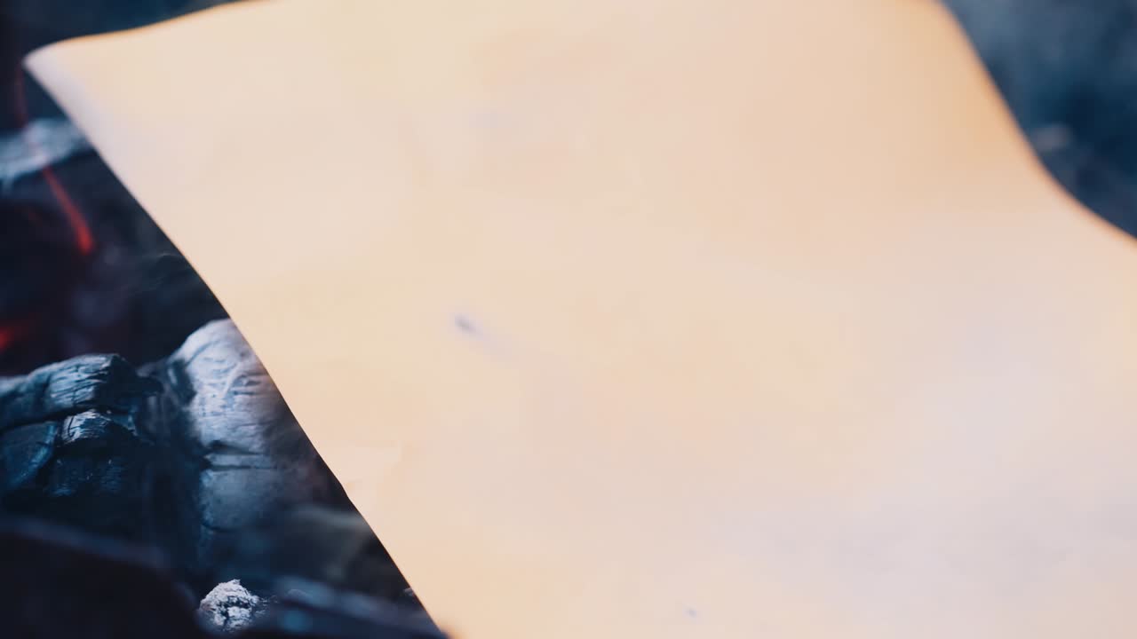 Flame when burning the paper in the bonfire