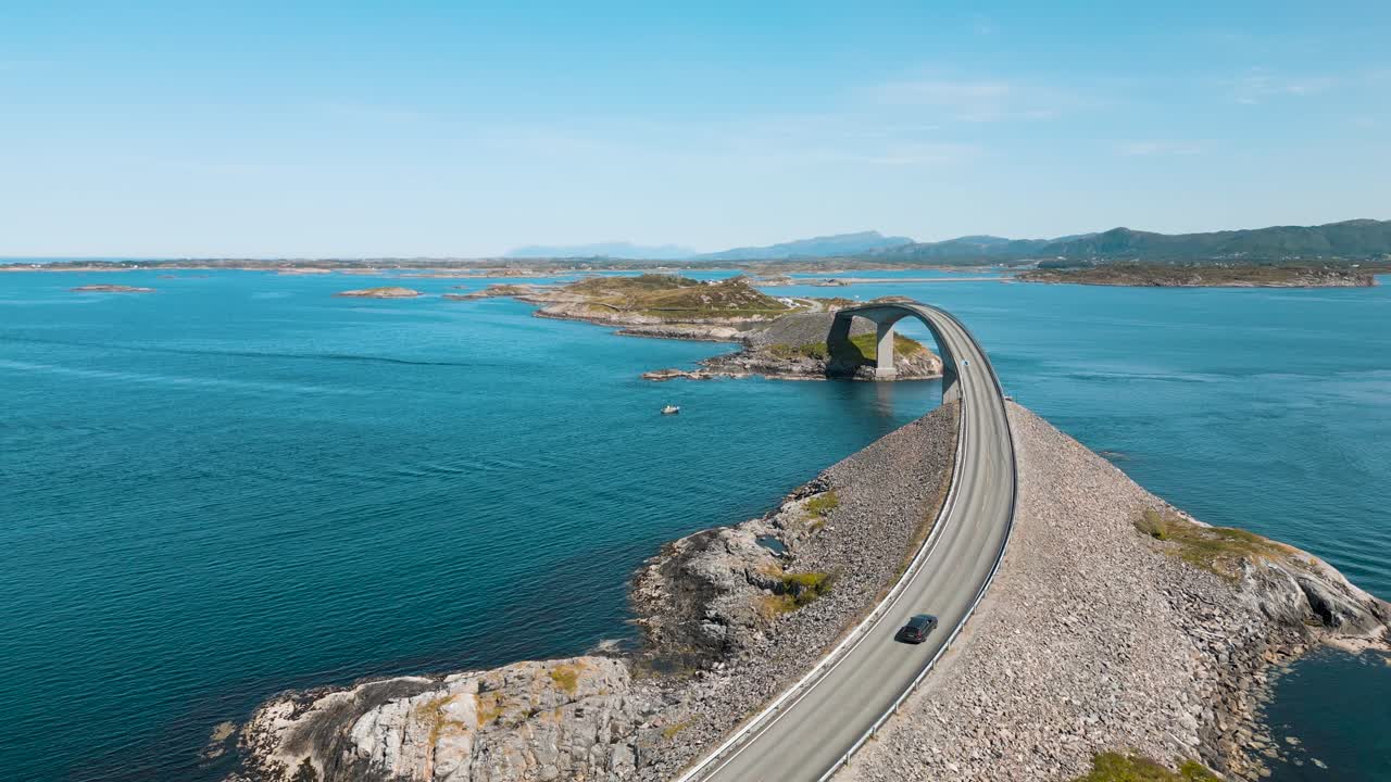 Aerial view of a car on Atlantic Road also known as &rdquo;The Road in the Ocean&rdquo; in Norway
