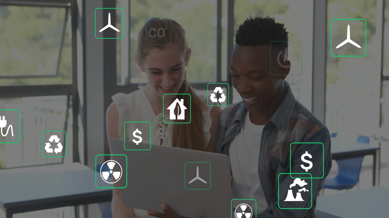 Two students sharing laptop, icons appearing then drifting and overlapping laptop, studying energy
