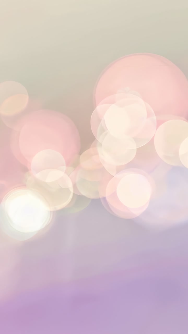 Vertical video: Displaying pastel bokeh scene remaining static on screen, for calm mood