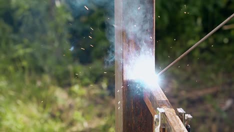 close view plank connected to pole with welding machine