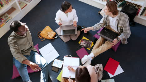 students in library, people study together