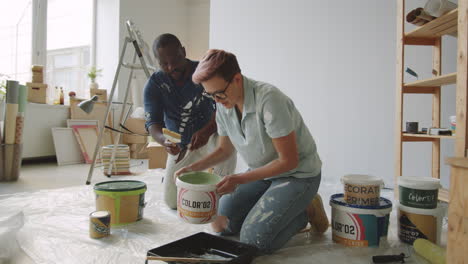 couple painting a room