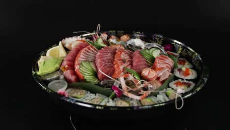 sushi platter being prepared and garnished