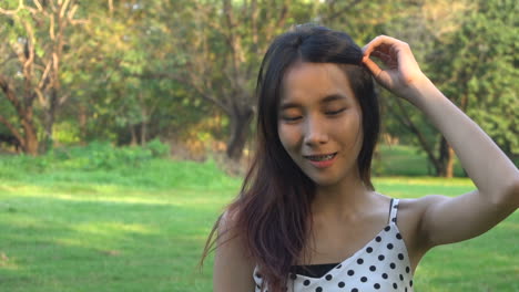 slow motion portrait of joyful asian woman.