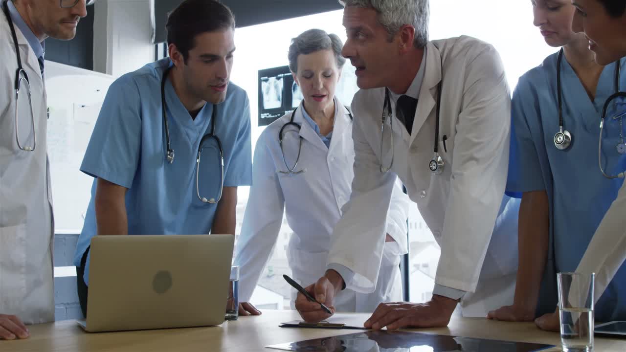 Doctors looking together a document