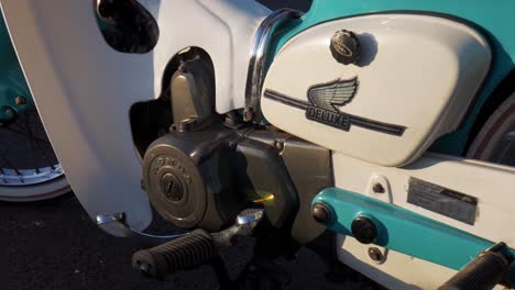 close-up of a vintage honda deluxe moped