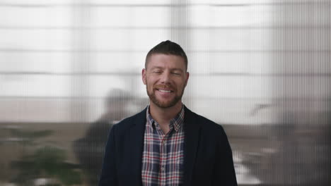 portrait of professional businessman smiling confident at camera enjoying executive lifestyle in office workspace background