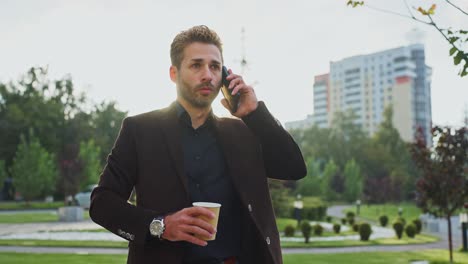 businessman talking on phone in the park
