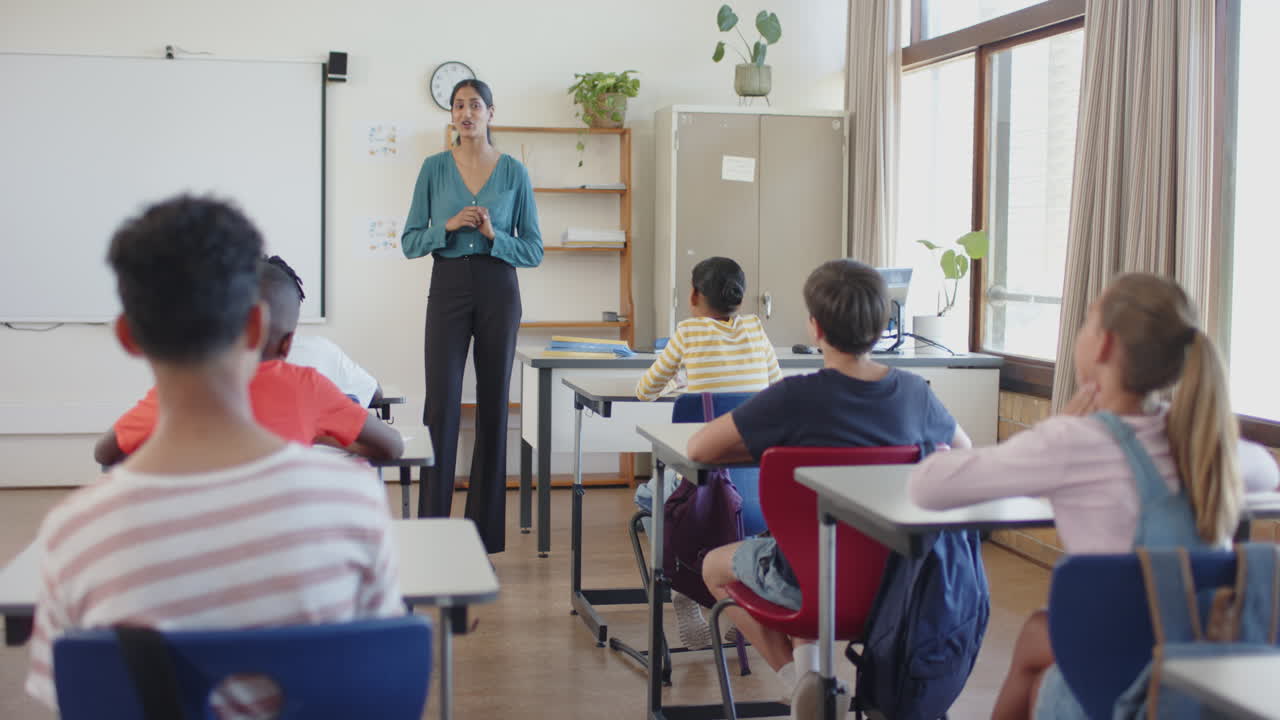 Engaging with students in classroom, teacher fostering interactive learning in school