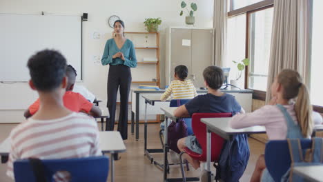 engaging with students in classroom, teacher fostering interactive learning in school