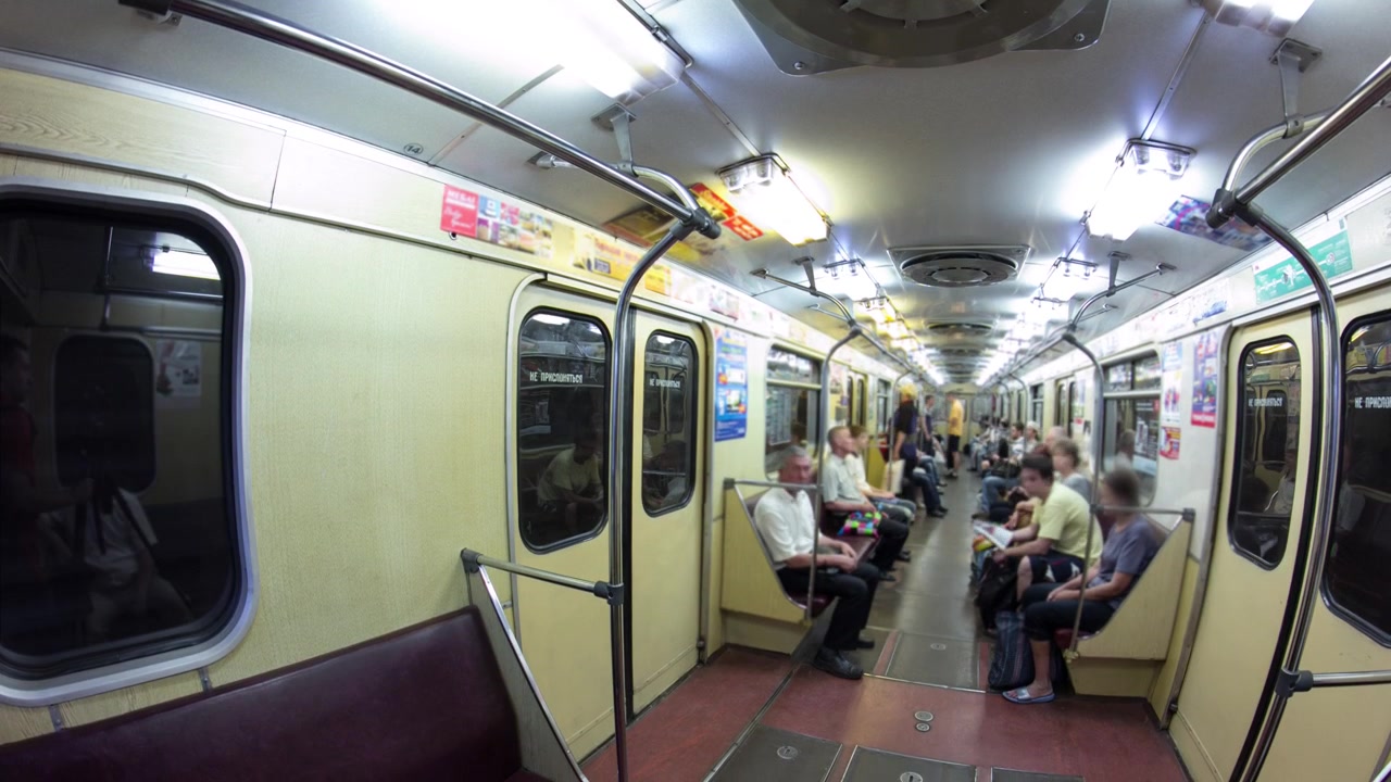 Unidentified passengers inside metro train timelapse. People going in and out
