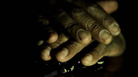 man-praying-to-god-with-hands-together-on-black-background-with-people-stock-video