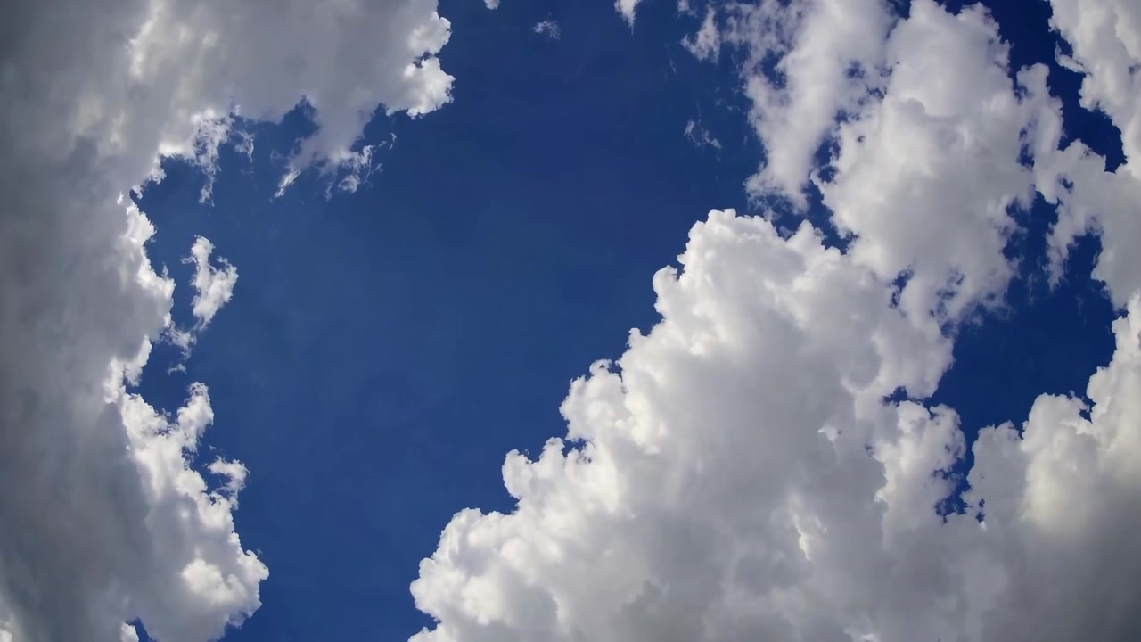 Time Lapse of White Cumulus Clouds Moving Across Blue Sky