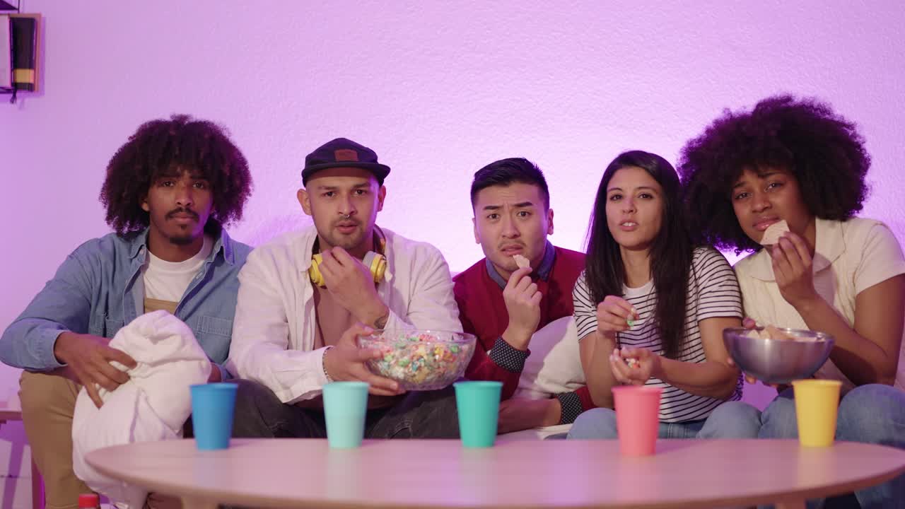 Group of friends watching TV