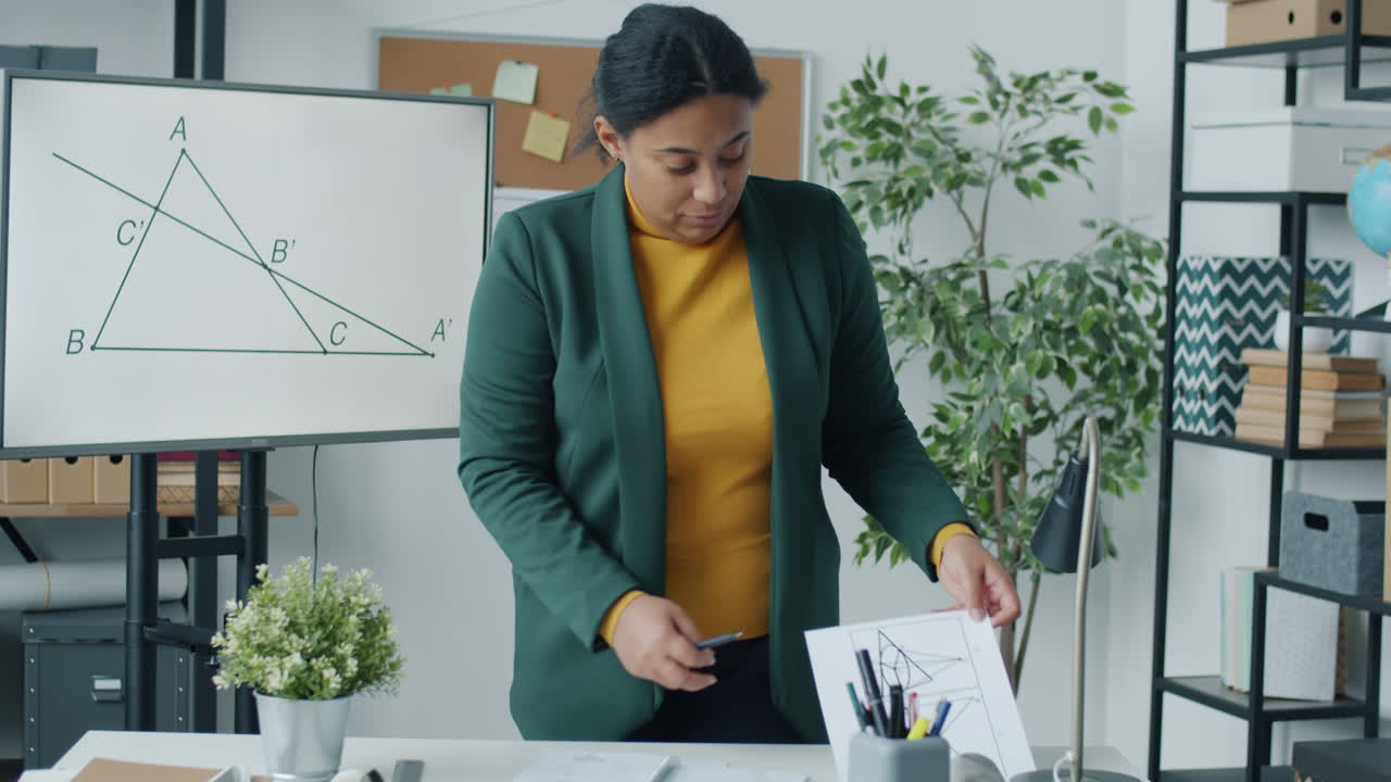 Teacher explaining geometry concepts in a classroom