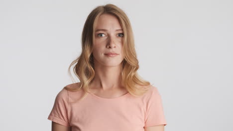 Caucasian woman waving no with the head on camera.