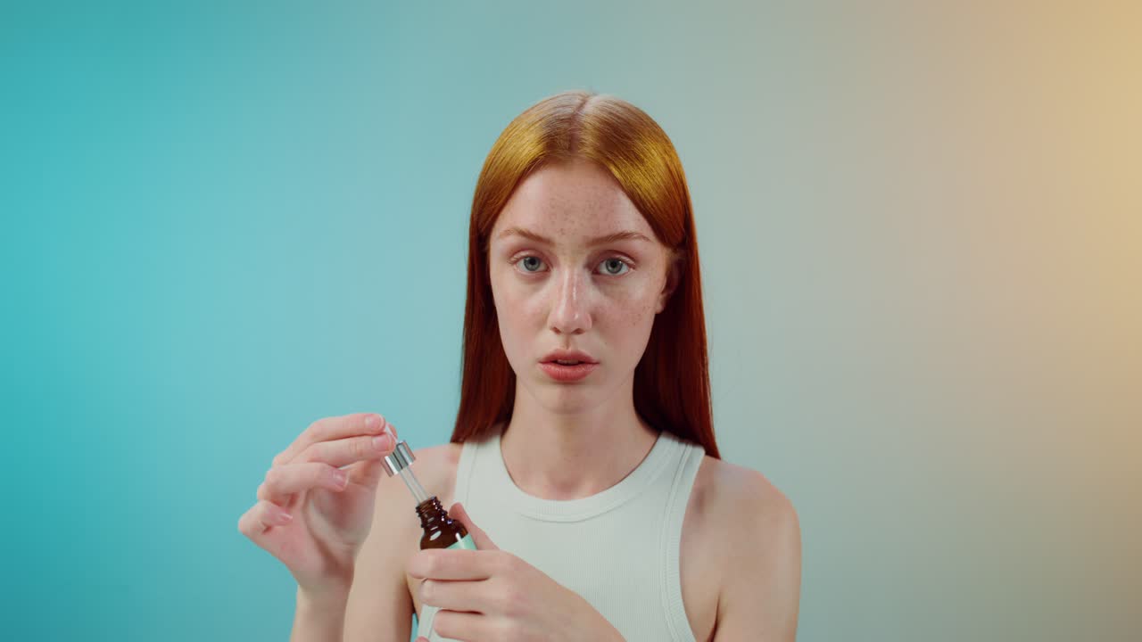 Young Woman Applying Serum