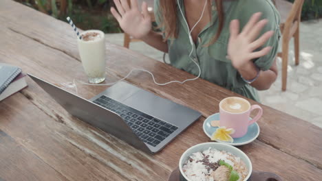 person working at breakfast in cafe