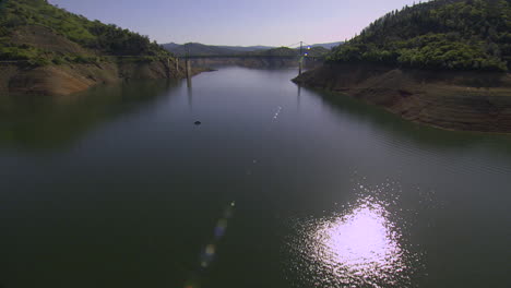 Aerial-Over-A-River-And-Bridge-In-California