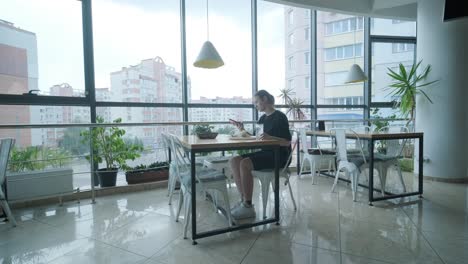 girl eating salad in cafe