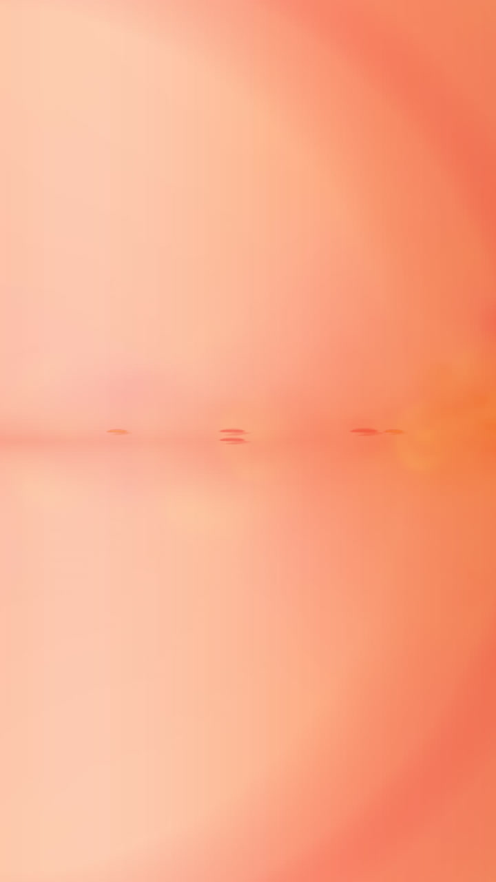 animación de puntos de luz sobre un fondo naranja