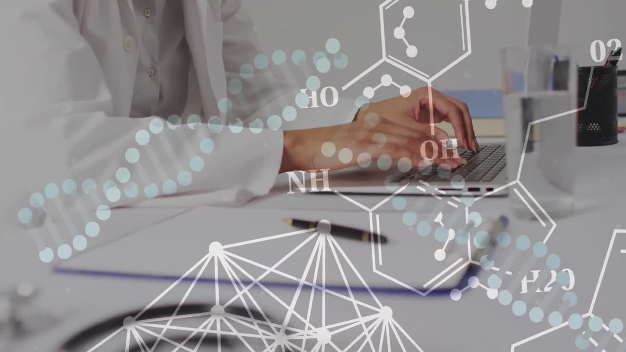 노트북을 이용한 두 인종의 여성 의사의 손 위에 있는 dna 줄무와 요소의 애니메이션