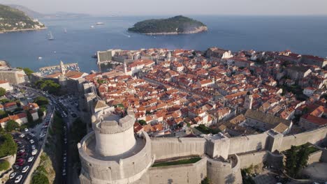aerial - dubrovnik, croatia: red roofs, adriatic sea, and historic castle