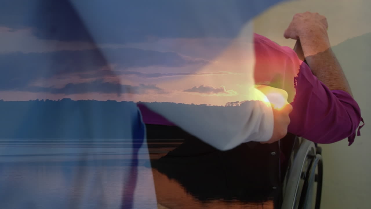 animación de paisaje sobre enfermera caucásica con hombre en silla de ruedas