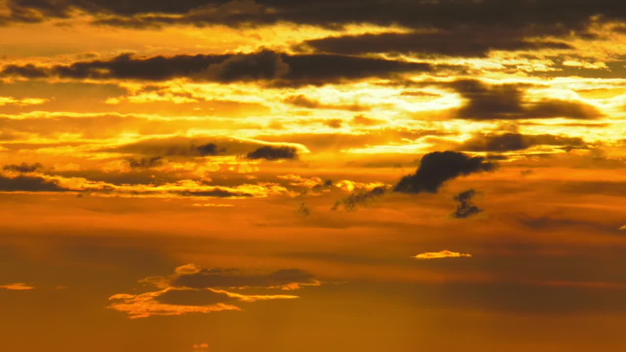 dramatic clouds at dawn, golden sunrise cloudscape