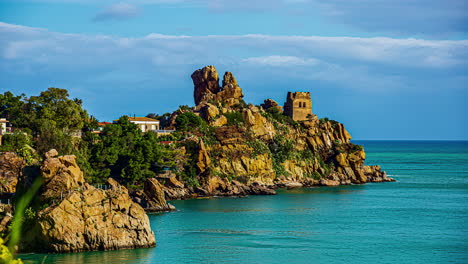 Static-view-of-residential-homes-on-the-rocky-cliffs-along-the-coast-near-cefalù,-Sicily,-Italy-at-daytime-in-timelapse