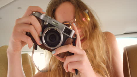 Young-woman-telling-someone-to-pose-while-taking