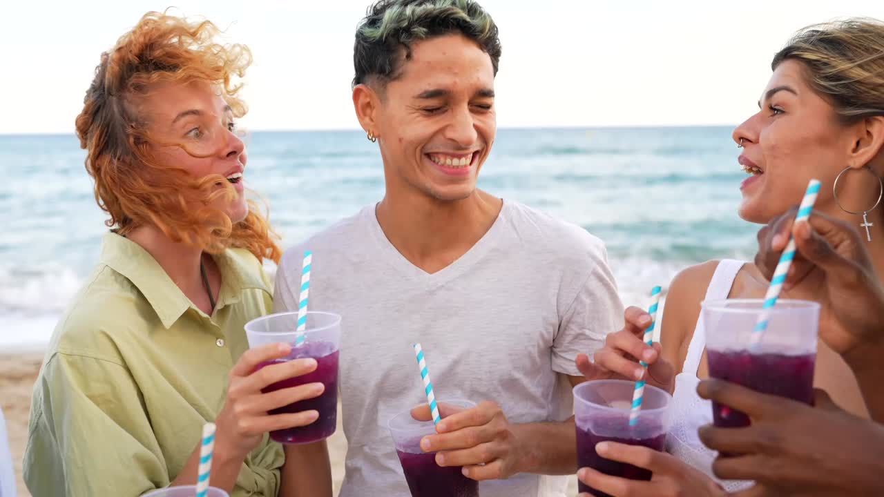Friends toasting drinks on the beach