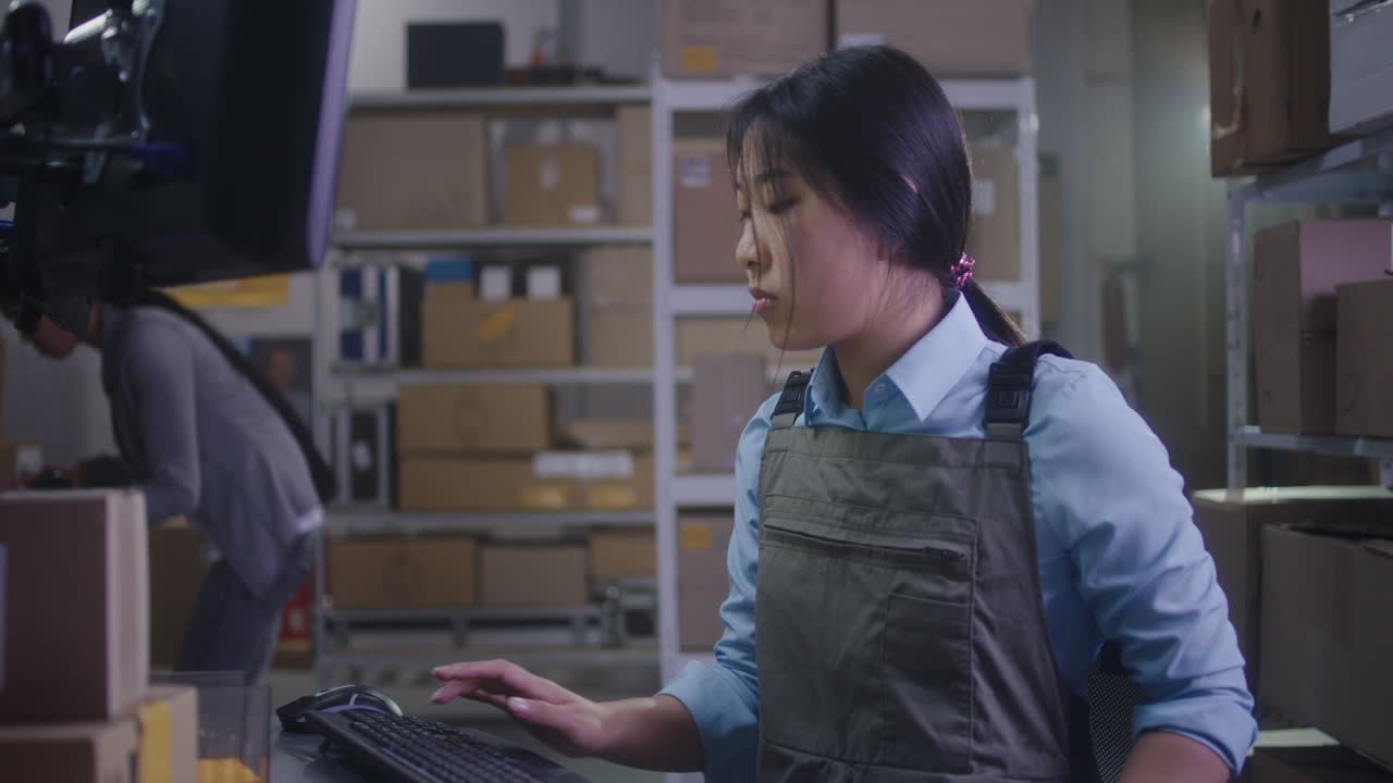 Warehouse Employee Working on Computer