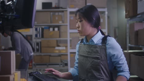 warehouse employee working on computer