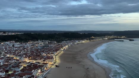 Coastal-city-of-Nazaré,-Portugal,-in-the-sunset
